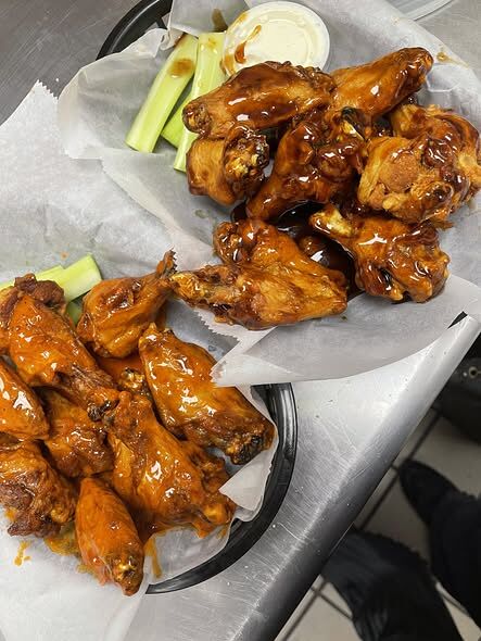 Bourbon glazed wings in a basket